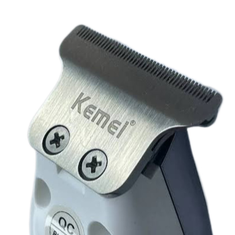 ماشین اصلاح کیمی مدل KM-5027 به همراه تیغه یدک اصلی و حک شده برند کیمی